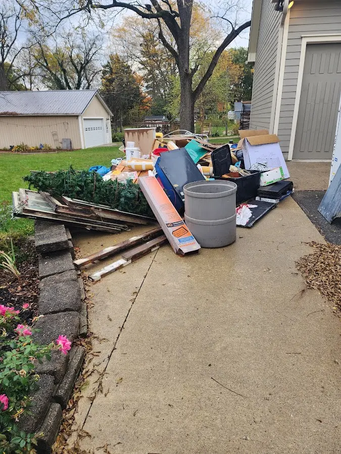 Dumpster being loaded with debris for Estate Cleanout Dumpster Rental in Rising Sun-Lebanon